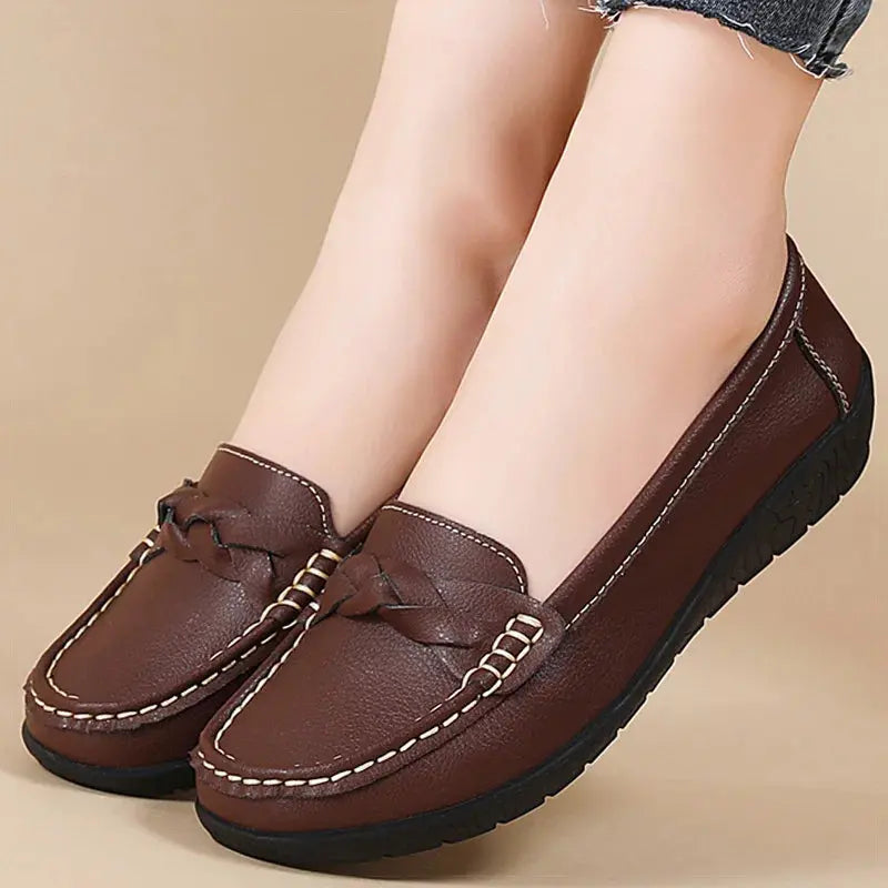 Black women's slip-on loafers in soft faux leather, polished everyday flats with effortless comfort design