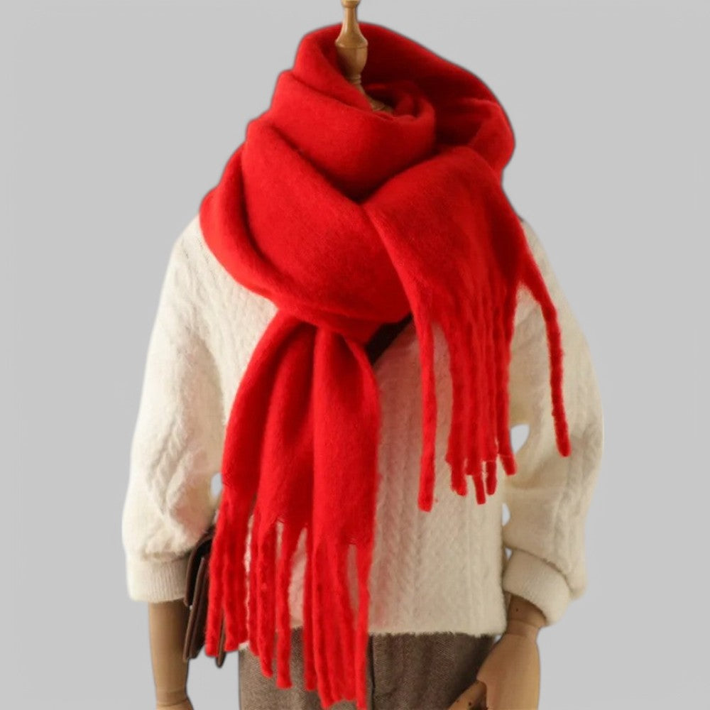 Women's oversized plush winter scarf in neutral tones with long fringed ends for cozy layered style