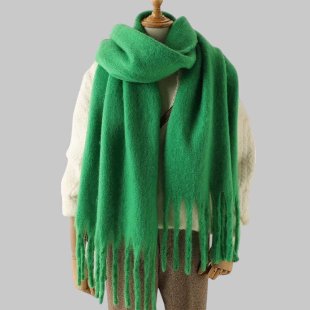 Women's oversized plush winter scarf in neutral tones with long fringe ends for elevated cold-weather style