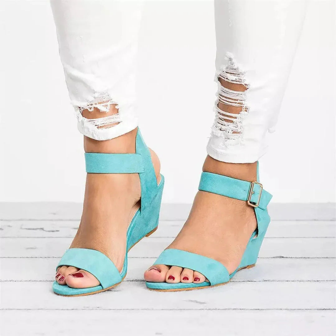 Women's beige suede open-toe wedge sandals with buckle ankle strap and cushioned comfort sole