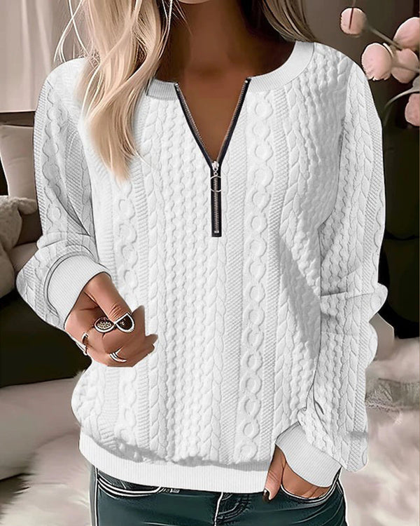 Cozy knitted half-zip sweater in neutral tones, relaxed fit with contemporary zip neckline for casual layering