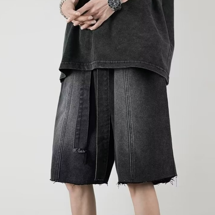 Faded blue denim shorts relaxed mid-thigh cut distressed fringe hem vintage wash streetwear style