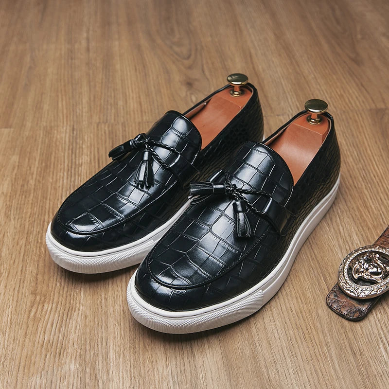Brown crocodile-embossed leather loafers with tassel accent and cushioned insole for professionals