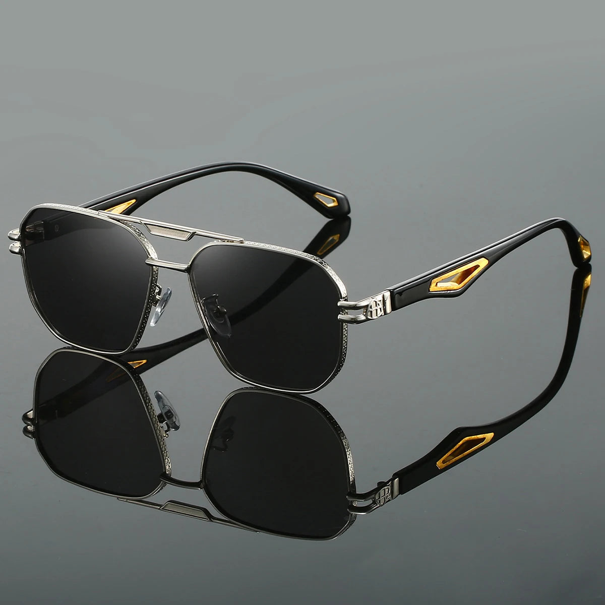 Bold gold UV400 aviator sunglasses with sculpted metal frame and distinctive temple inlays