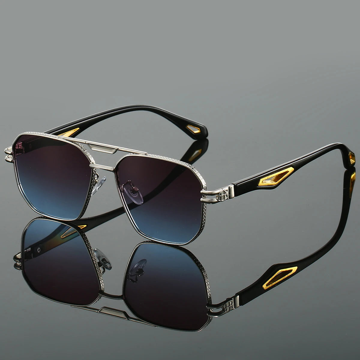 Bold UV400 aviator sunglasses with sculpted metal frame, distinctive temple inlays, and sleek silver finish