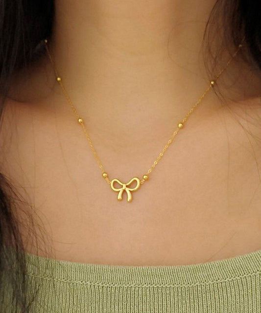 Collier élégant avec pendentif nœud en acier inoxydable doré - Urbann-Vibe