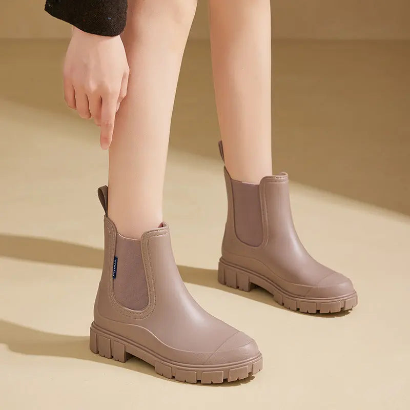 Women's waterproof PVC ankle rain boots in clear style, lightweight design for all-weather everyday wear