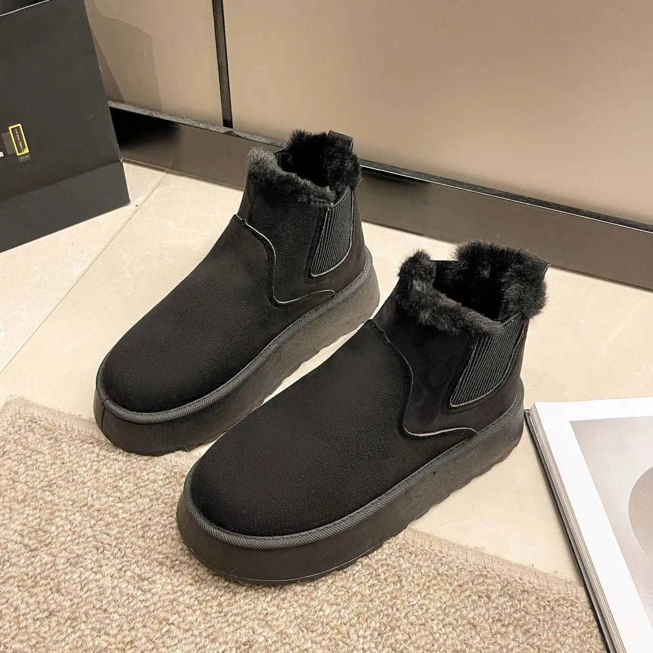 Women's winter snow boots in white synthetic leather with plush lining and cozy cold-weather style