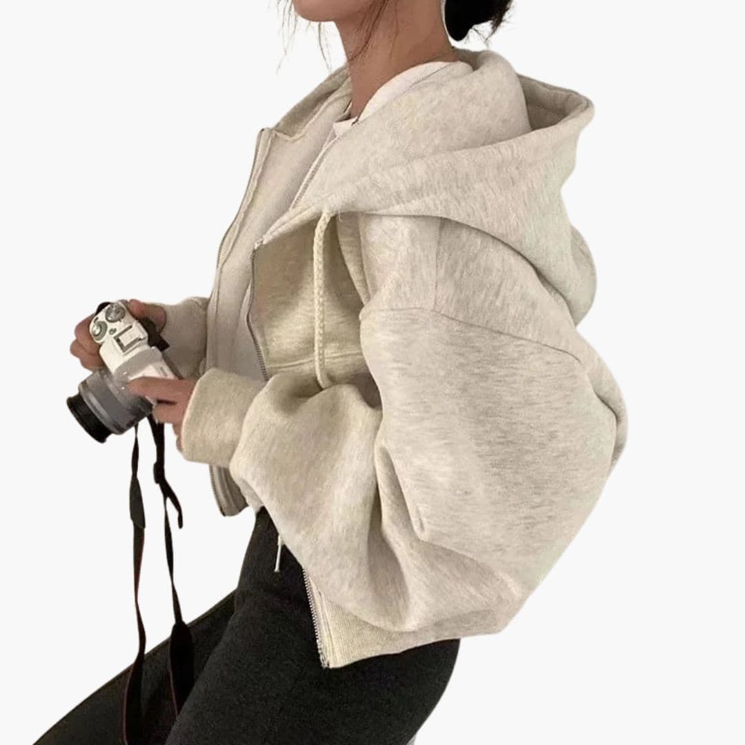 Women's short zip-up hoodie sweatshirt with large drawstring hood and cozy front pockets