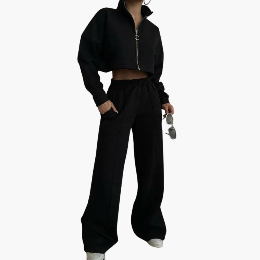 Women's black cropped zip-up sweatshirt set with high collar, elastic cuffs, and matching pants