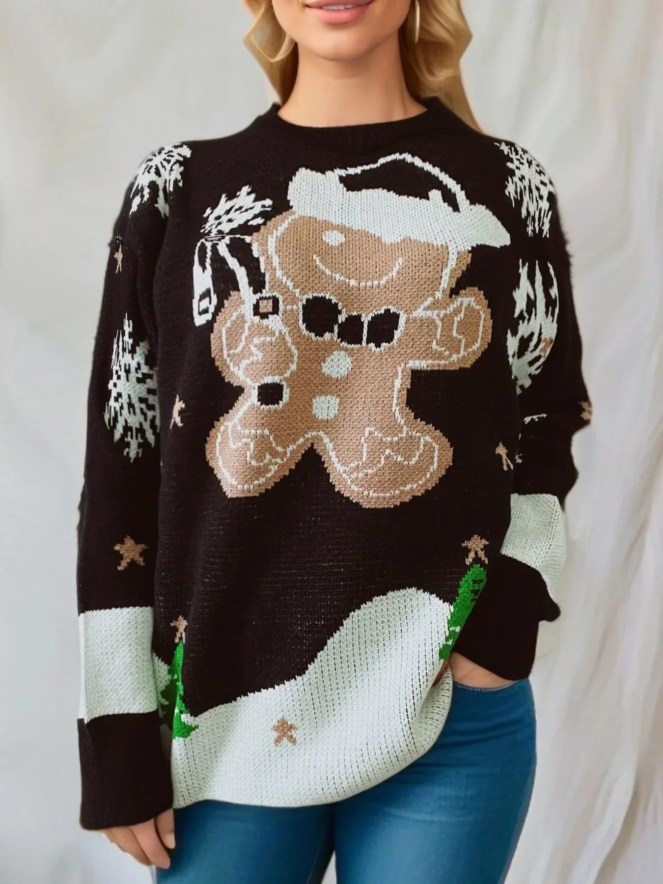 Women's red relaxed-fit Christmas knit sweater with gingerbread man Santa hat snowflake details
