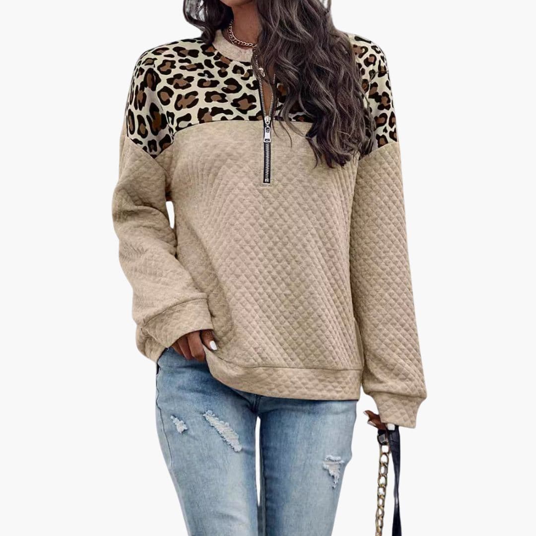 Women's animal print half-zip sweatshirt with quilted detailing, relaxed fit cozy casual style