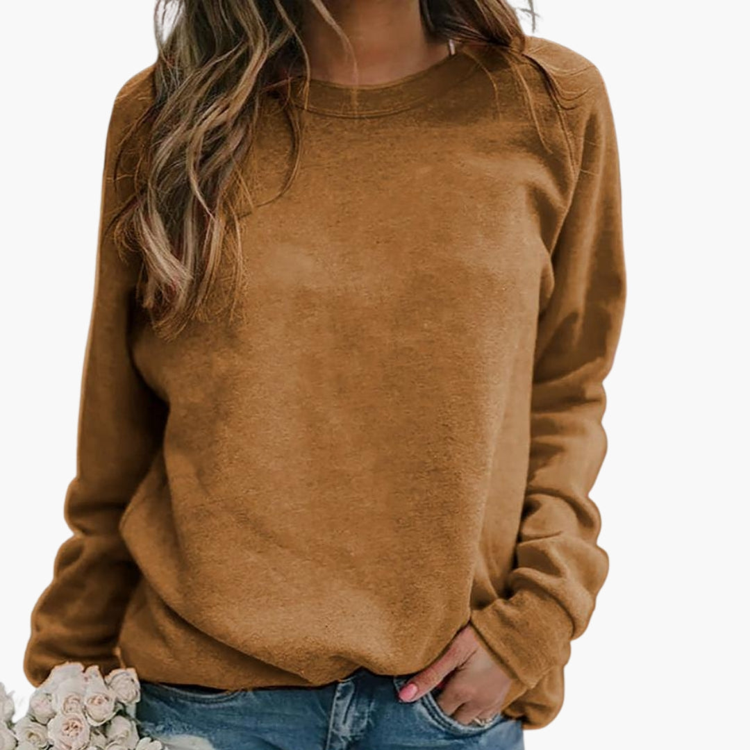 Women's solid pullover sweatshirt round neck long sleeves ribbed cuffs hip length casual comfort fit