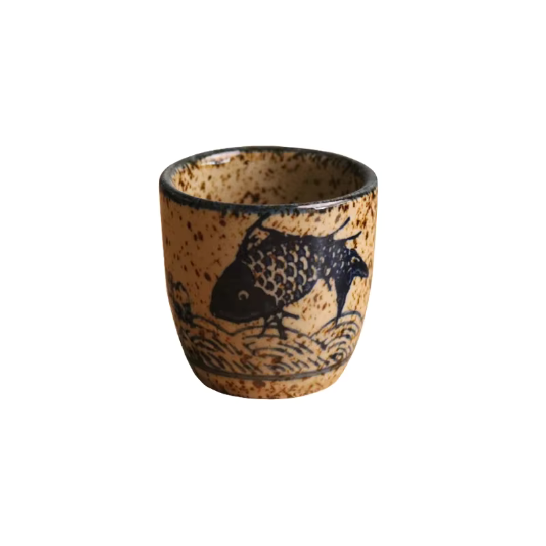 Handcrafted ceramic tumbler with textured hand-glazed finish and Hanami motifs for tea and sake lovers