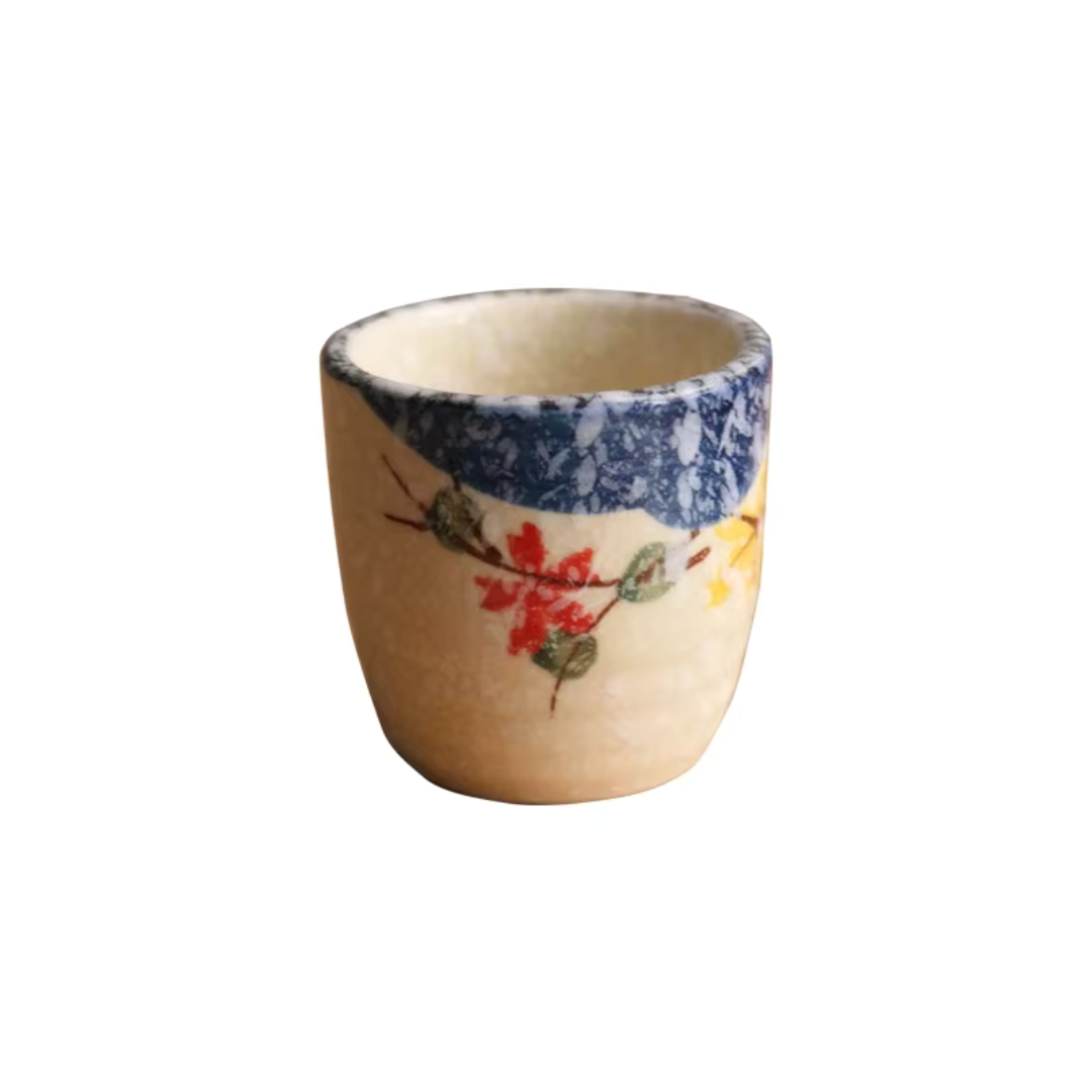 Handcrafted ceramic tumbler hand-glazed textured finish Hanami motifs Japanese artisan style tea and sake