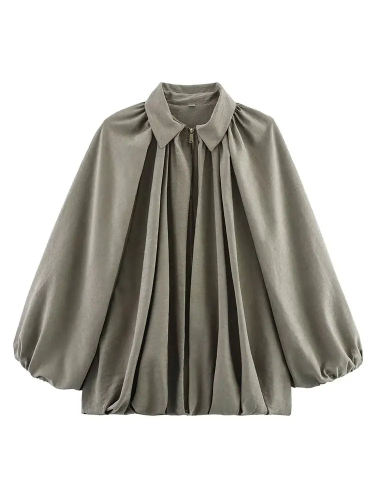 Vintage loose bomber jacket soft sheen lightweight voluminous silhouette relaxed tailoring versatile layering