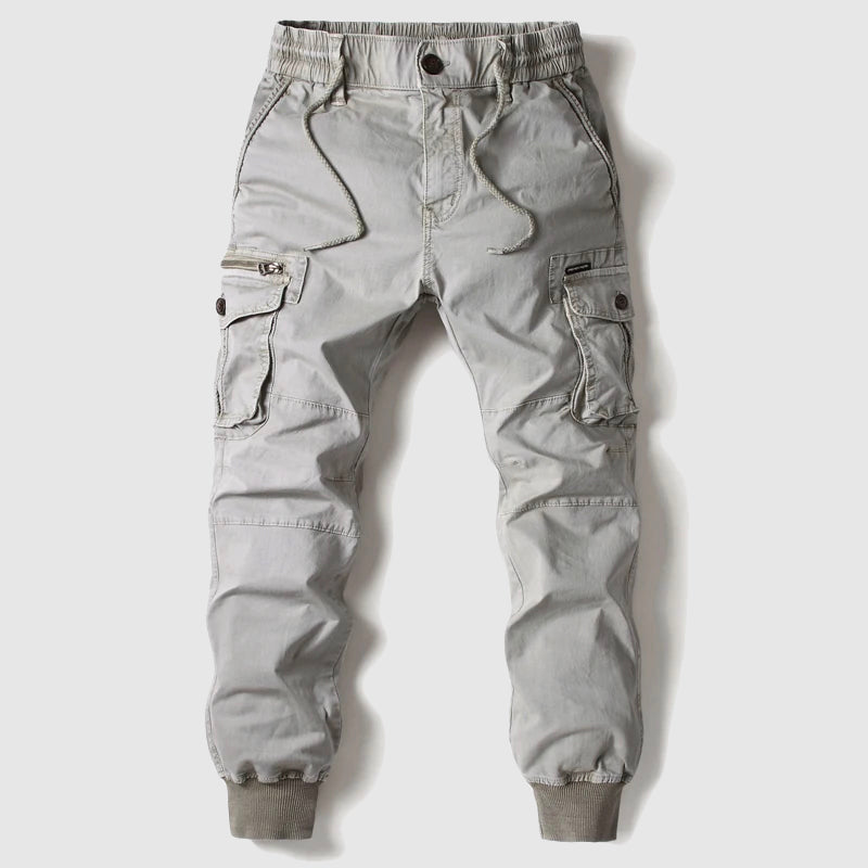 Black men's cargo jogger pants with elastic waistband, cuffed ankles, and multi-pocket design