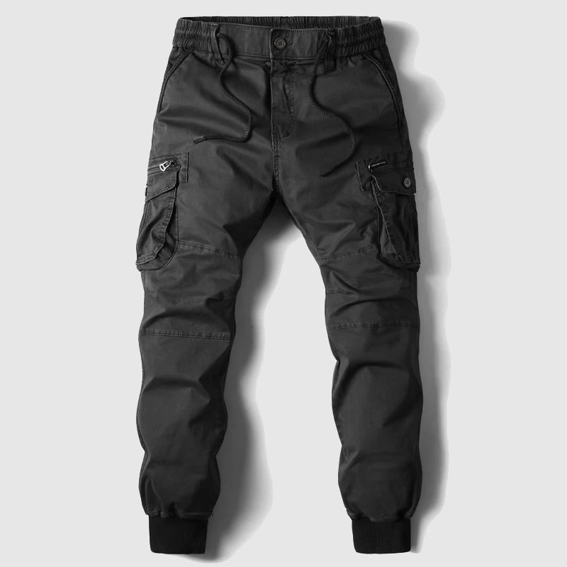 Black men's cargo jogger pants with elastic waistband, cuffed ankles, and multi-pocket design