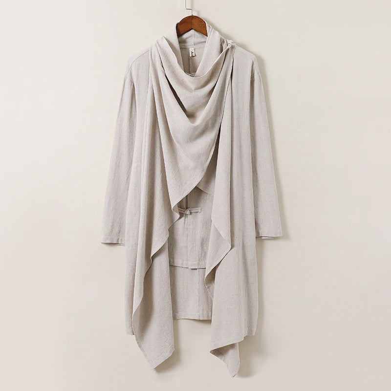 Beige linen blend flowing cape with minimalist knot buttons, lightweight Japanese-inspired elegant silhouette