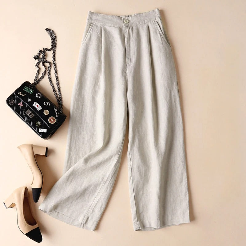 Premium Tencel linen relaxed-fit tailored pants in neutral tone with fluid drape and button closure