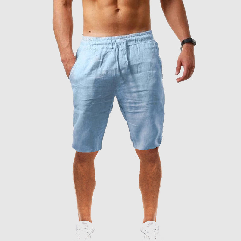 Men's beige slim-fit linen-blend beach shorts with elastic waistband and functional pockets