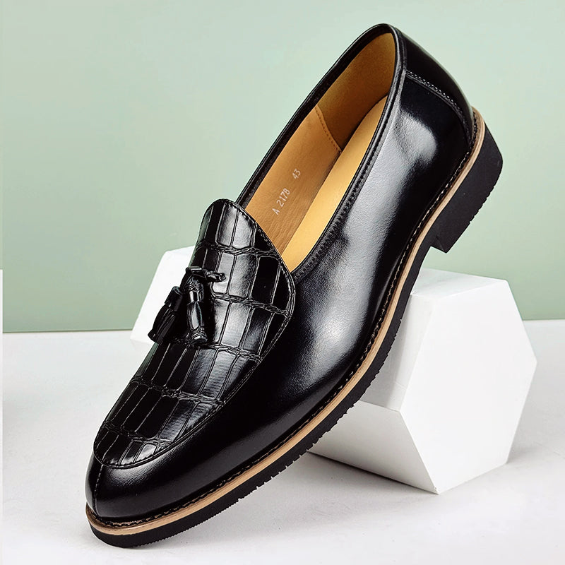 Dark brown tassel loafers with crocodile-embossed vamp in refined microfiber leather slip-on style
