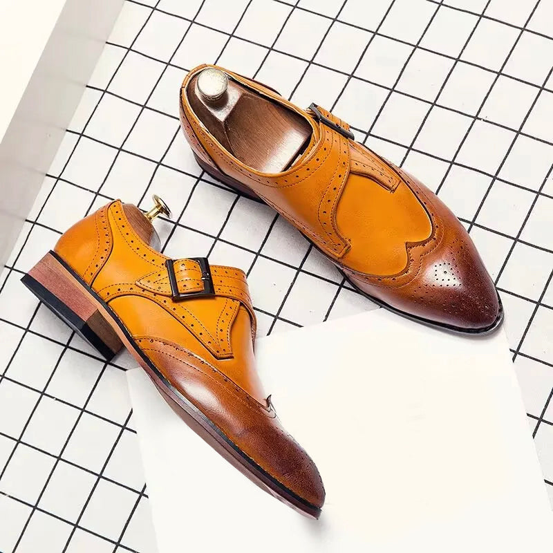 Men's brown pointed-toe Oxford dress shoes with decorative brogue detailing for smart-casual professionals