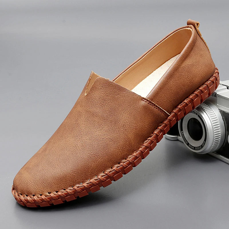 Men's brown premium leather slip-on loafers with refined round toe and timeless Santorini style