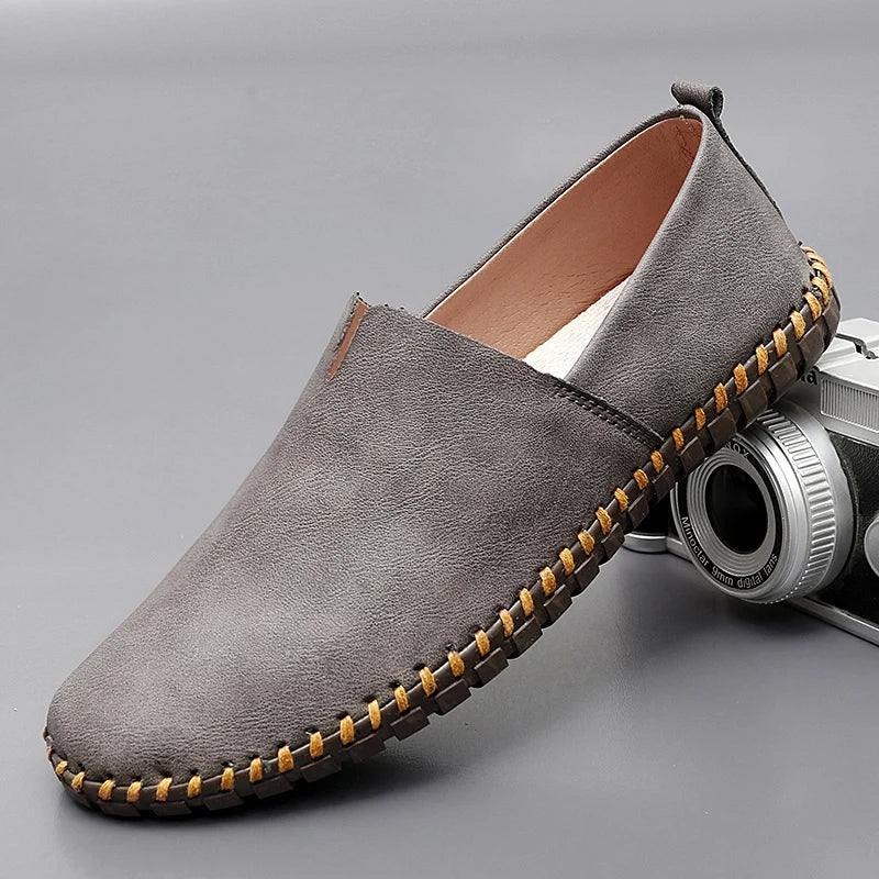 Men's brown premium leather slip-on loafers with refined round toe for casual and semi-formal wear