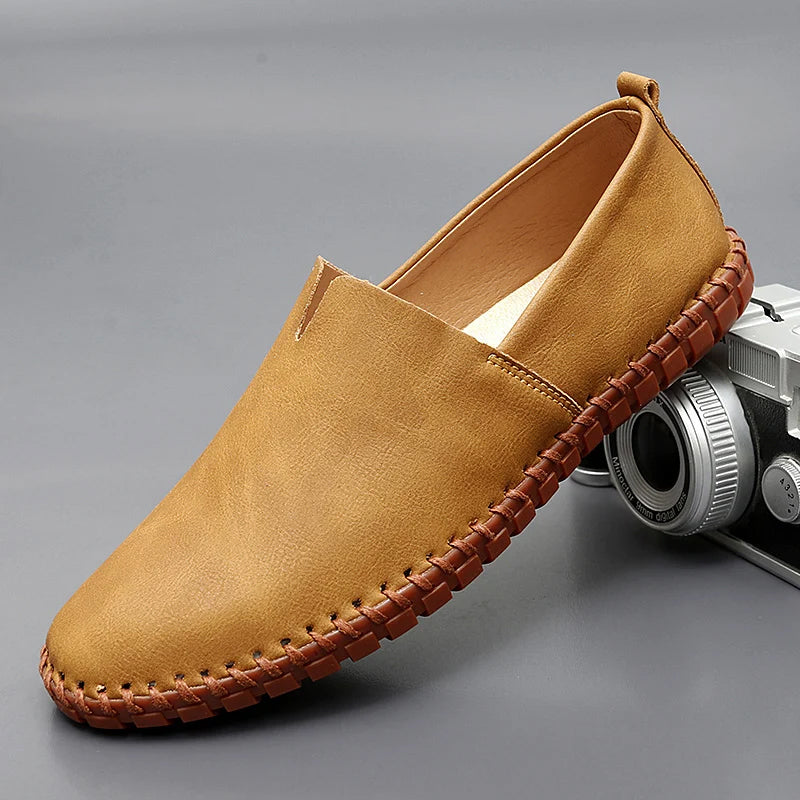 Men's brown premium leather slip-on loafers with refined round toe and timeless Santorini style