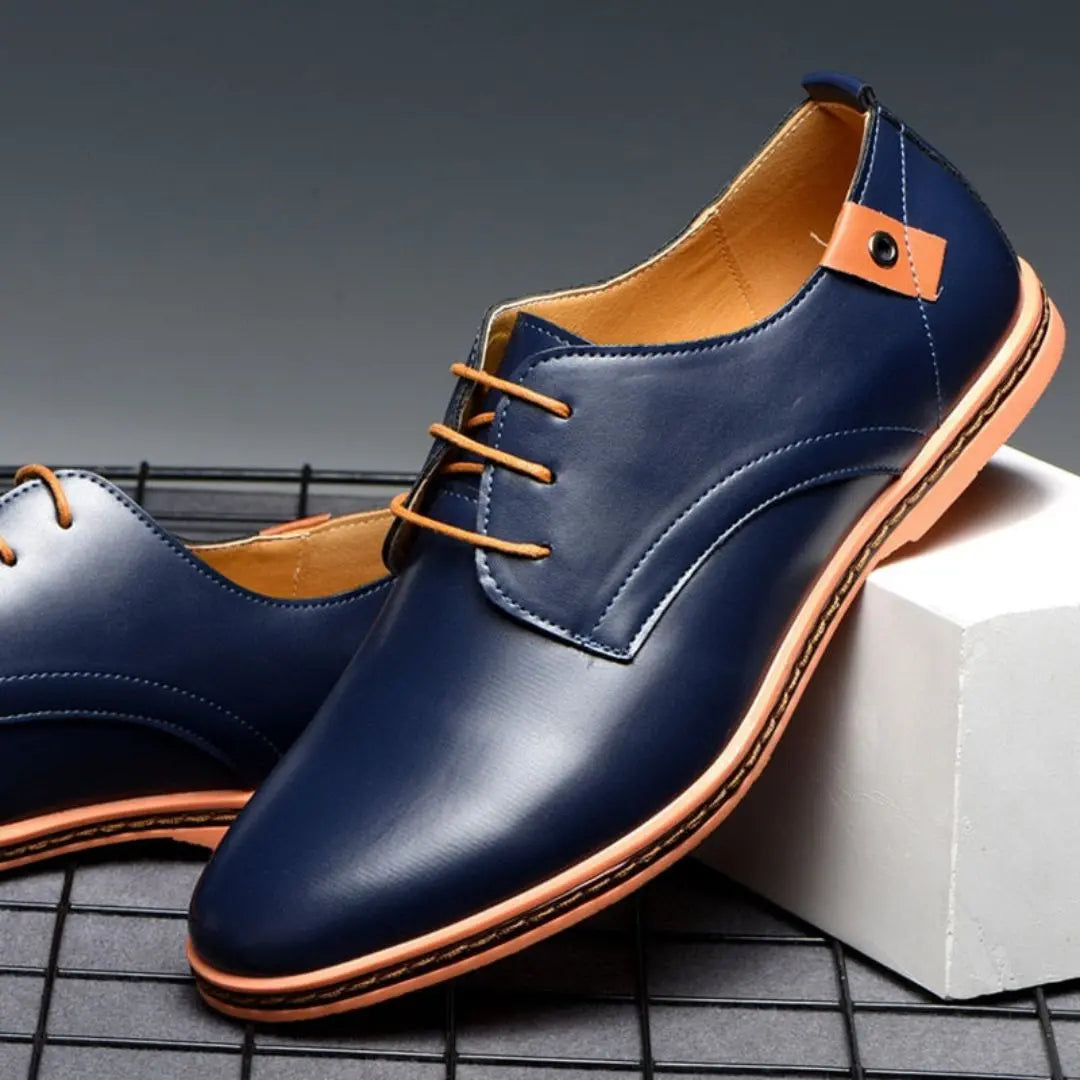 Black polished derby shoes with contrasting sole, sleek contemporary silhouette for professionals