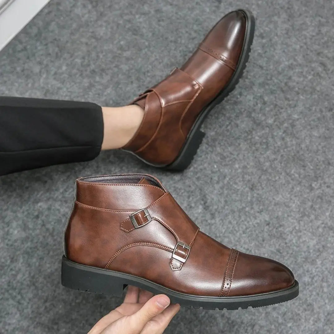 Men's brown leather brogue boots with double monk strap closure and decorative perforations