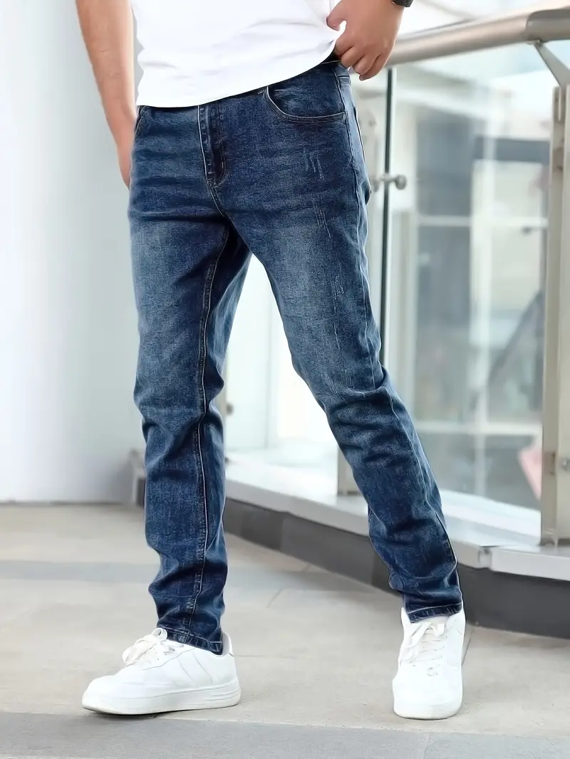 Men's slim fit blue denim jeans with aerodynamic silhouette and flexible stretch comfort