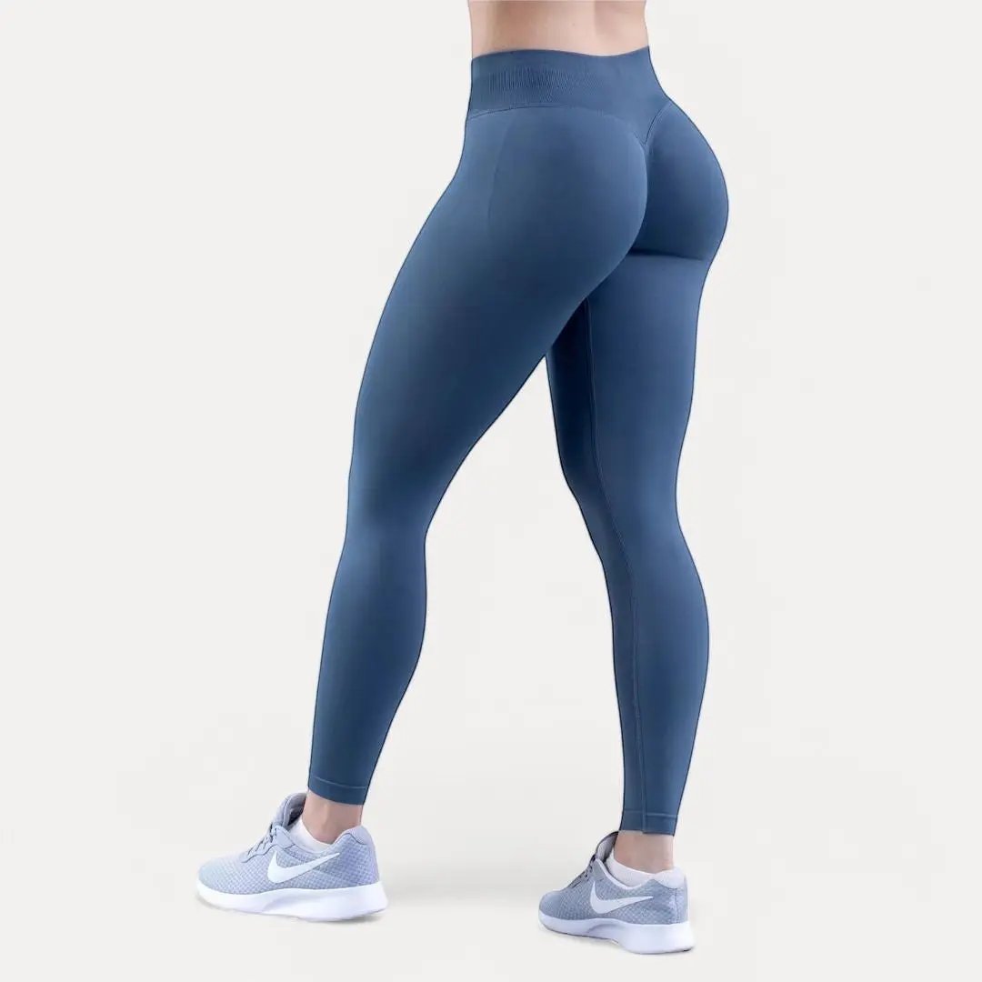 Women's black high-waist compression leggings with butt-lift scrunch seam and seamless sculpting fit