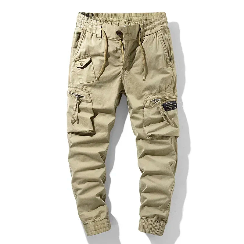Dark utility jogger pants tapered fit with tactical zip pockets and stretch waistband
