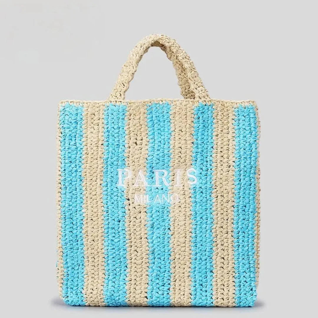 Handcrafted woven straw tote bag with bold vibrant stripes, lightweight beach carryall for women