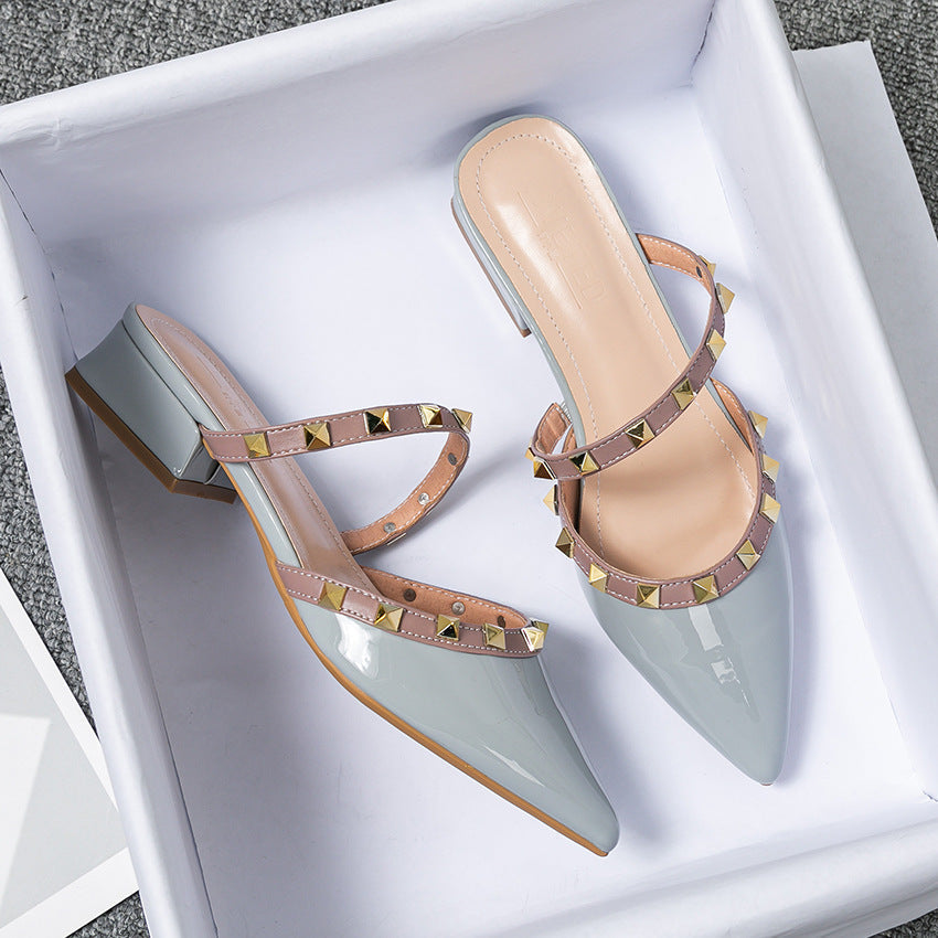 Glossy patent pointed-toe mules with dual studded straps, edgy rock-inspired style for women
