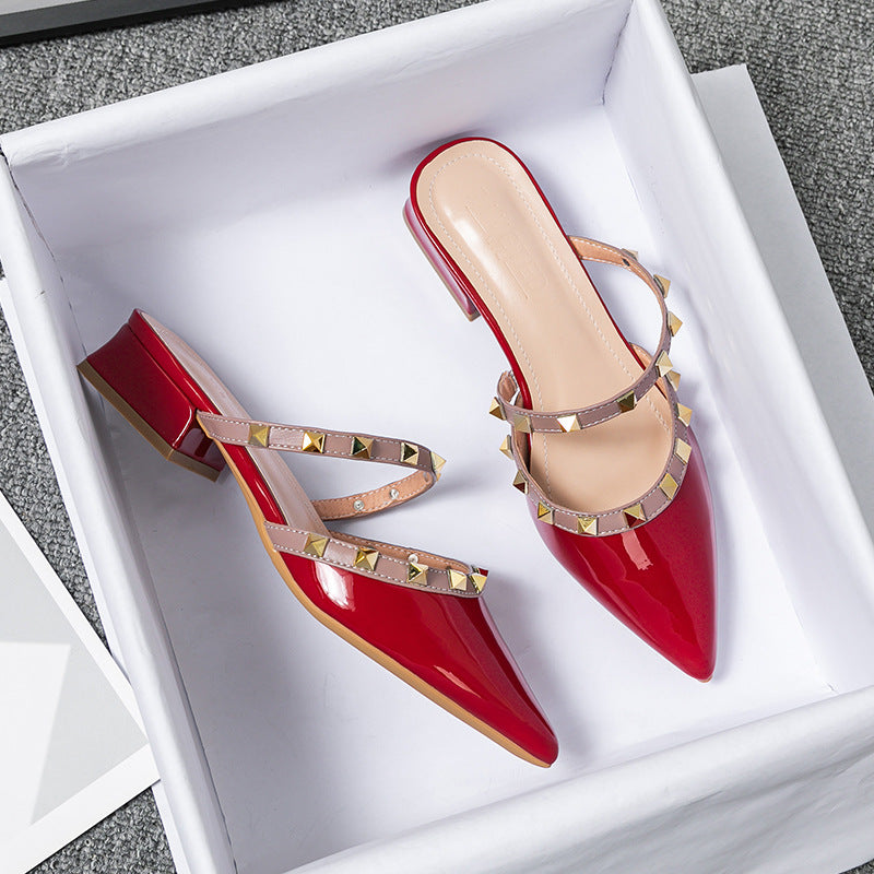 Glossy patent pointed-toe mules with dual studded straps, edgy rock-inspired style for women