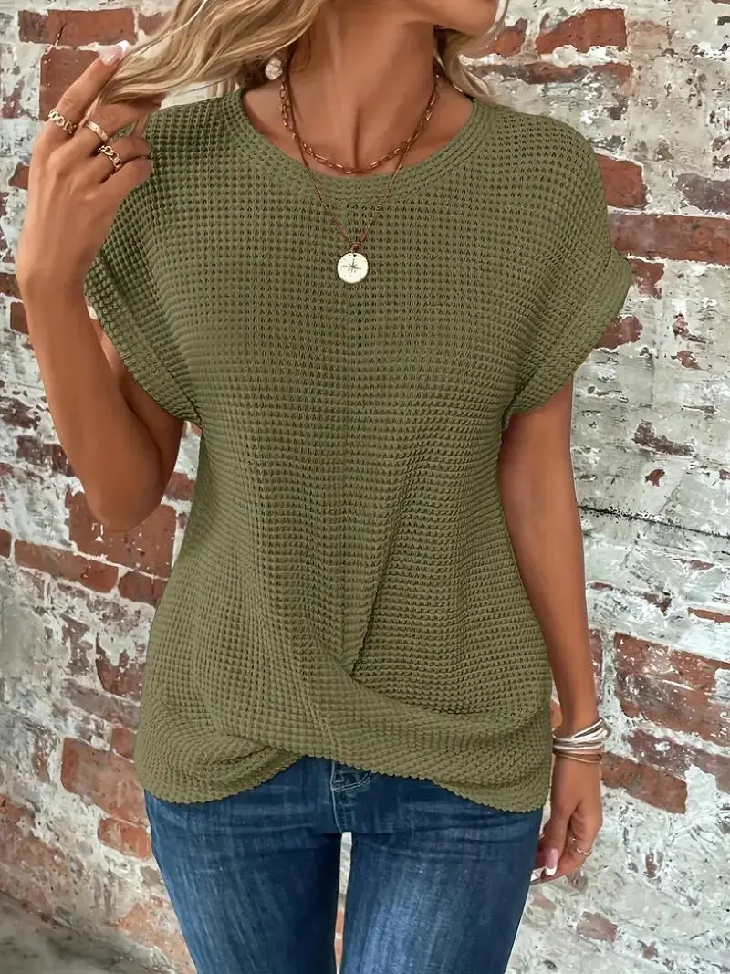 Women's relaxed waffle knit tee in neutral tone with flattering front twist-hem knot detail