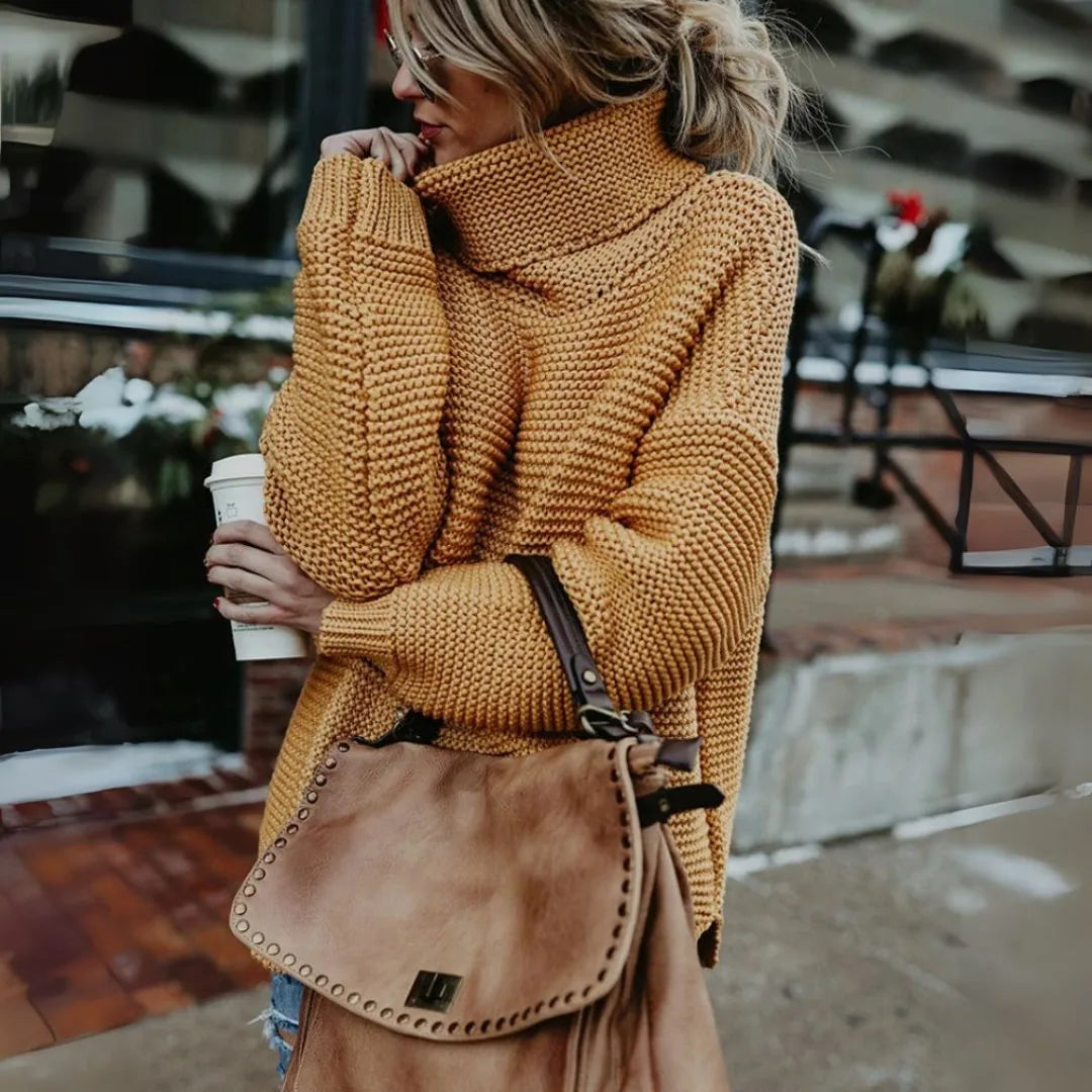 Women's cream chunky knit oversized turtleneck sweater with relaxed silhouette and cozy texture