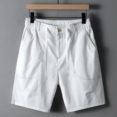 Men's olive streetwear utility shorts with oversized contrast-stitched pockets and elastic drawstring waist