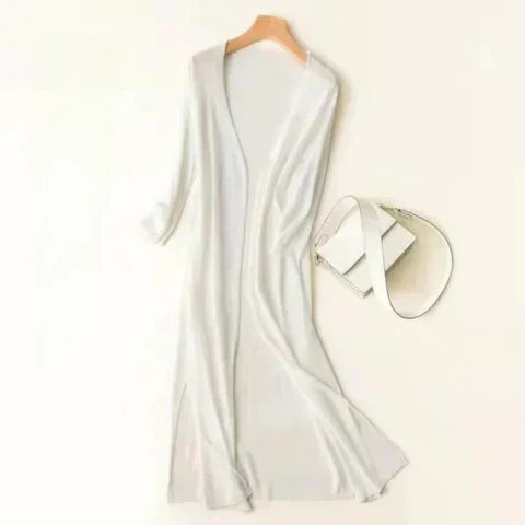 Women's lightweight open-front knit cardigan poncho silhouette breathable neutral-tone everyday layer