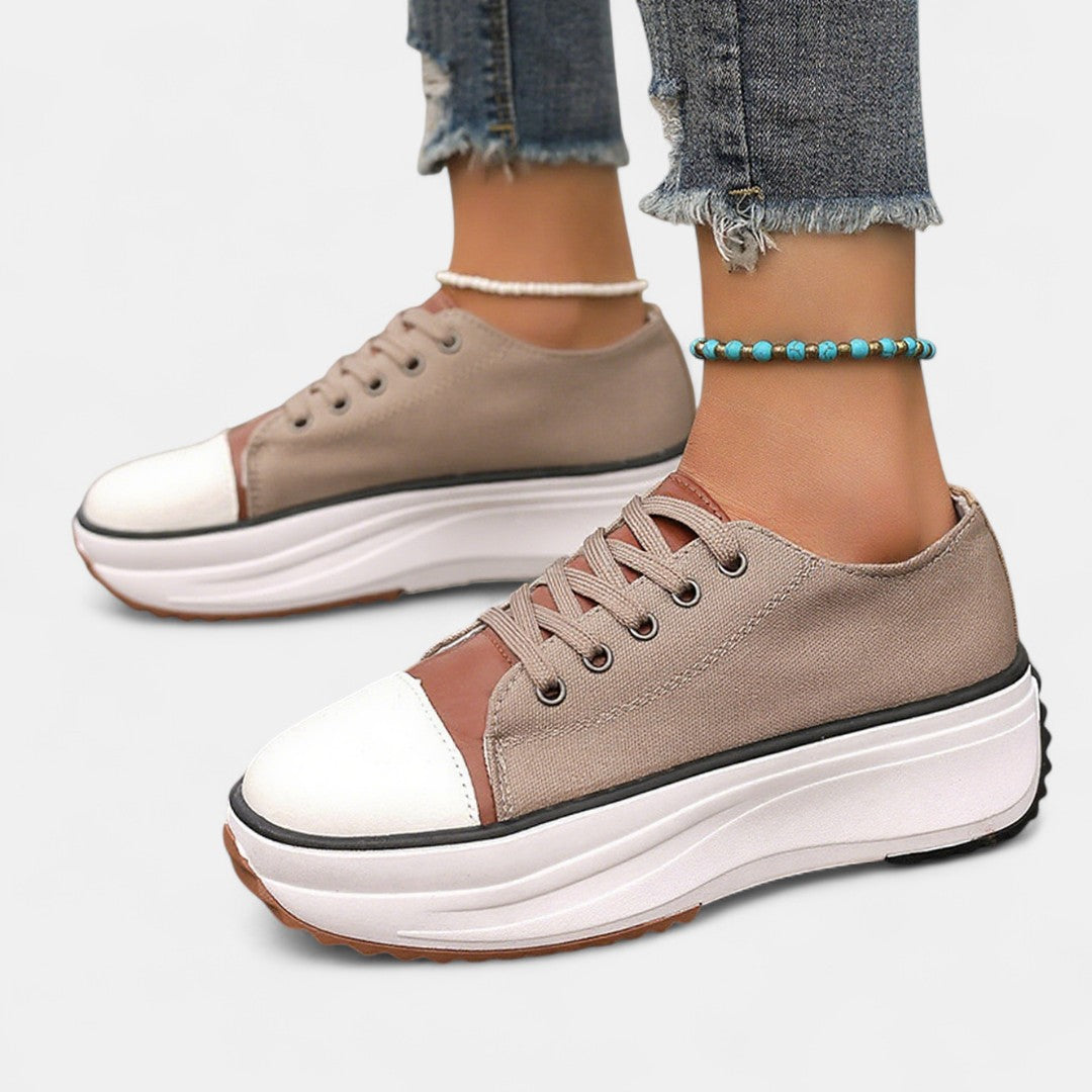 White canvas platform lace-up sneakers with chunky thick sole and rounded contrast toe
