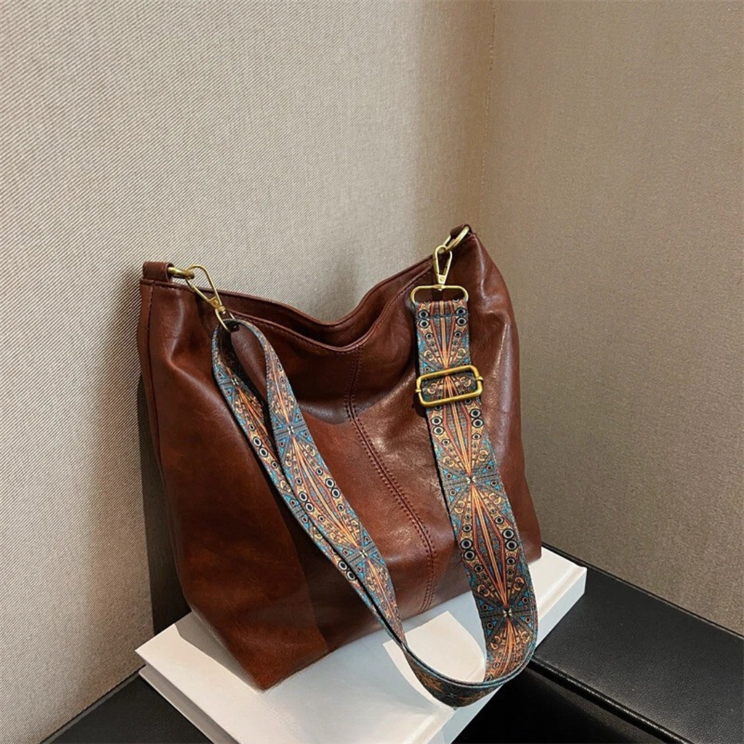Women's everyday shoulder bag with wide adjustable strap, large interior pocket, versatile casual style