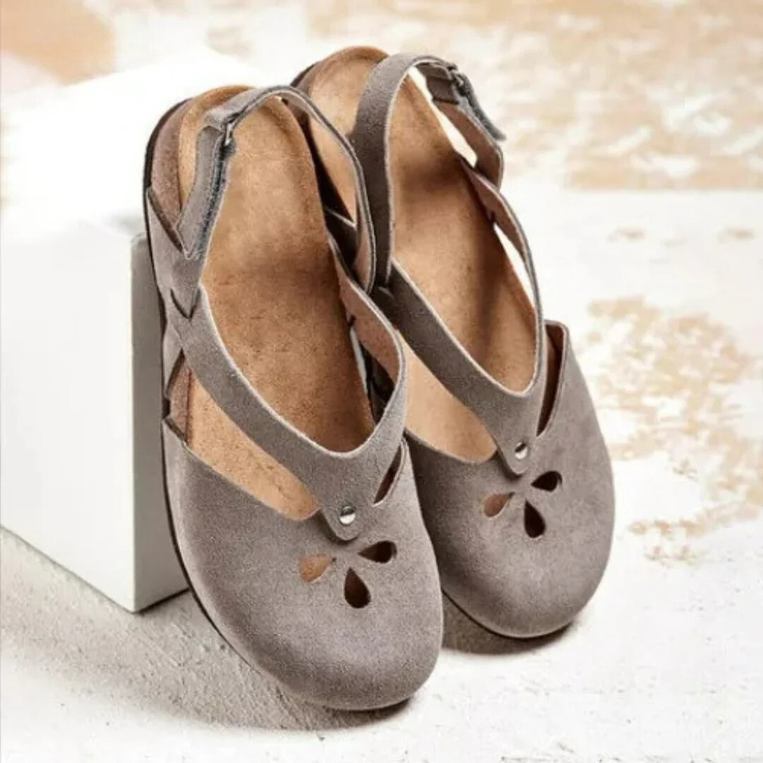 Women's closed toe slingback sandals with cross-strap detail in neutral tone, sleek everyday elegance