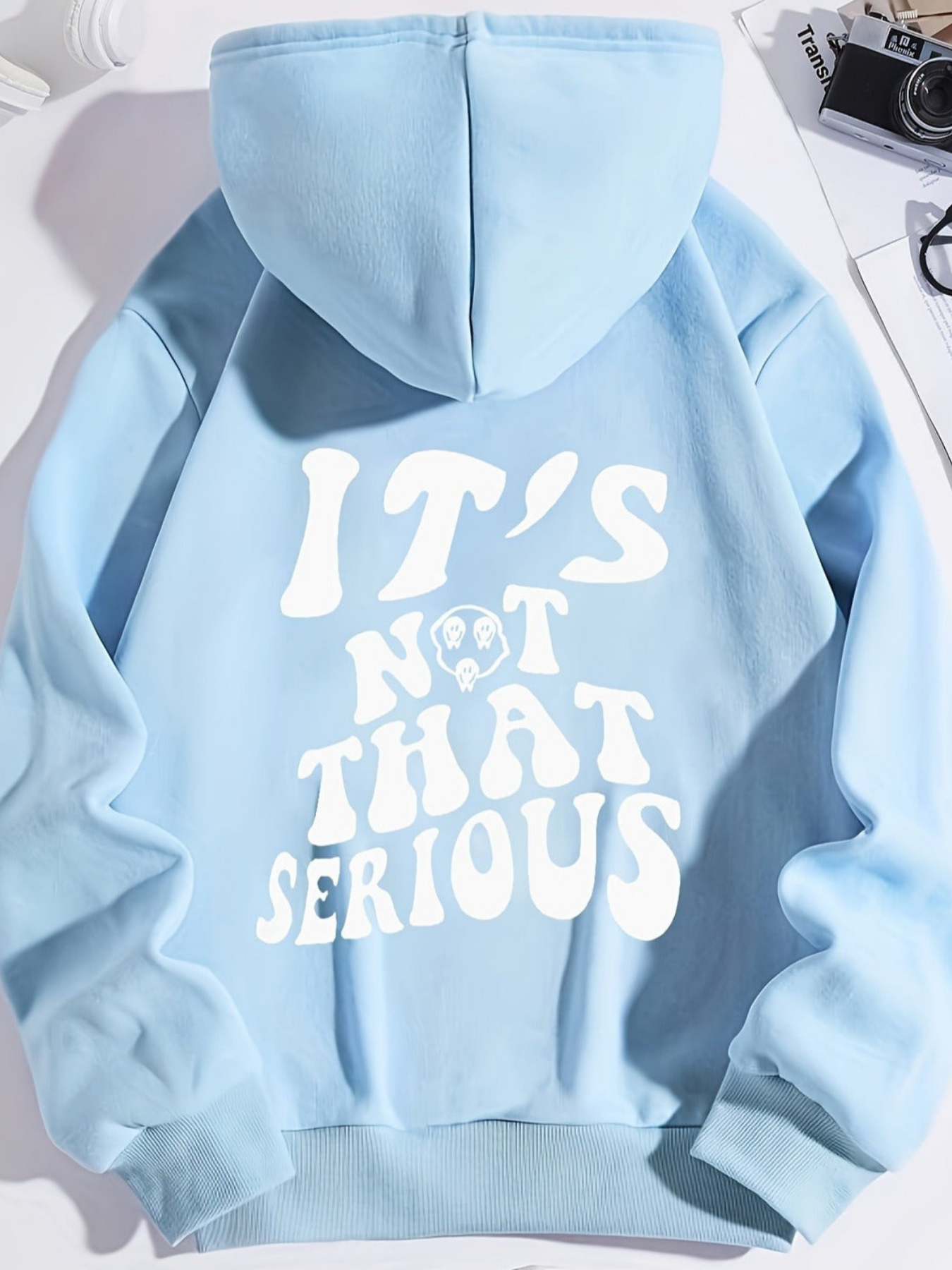 Women's relaxed fit hoodie with "It's Not That Serious" slogan, cozy loose silhouette for busy days