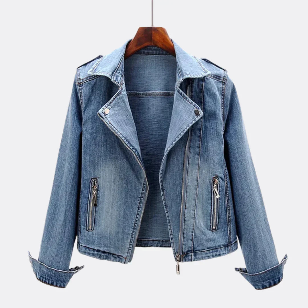 Blue organic denim short jacket with dramatic voluminous oversized collar, bold rebellious fashion statement