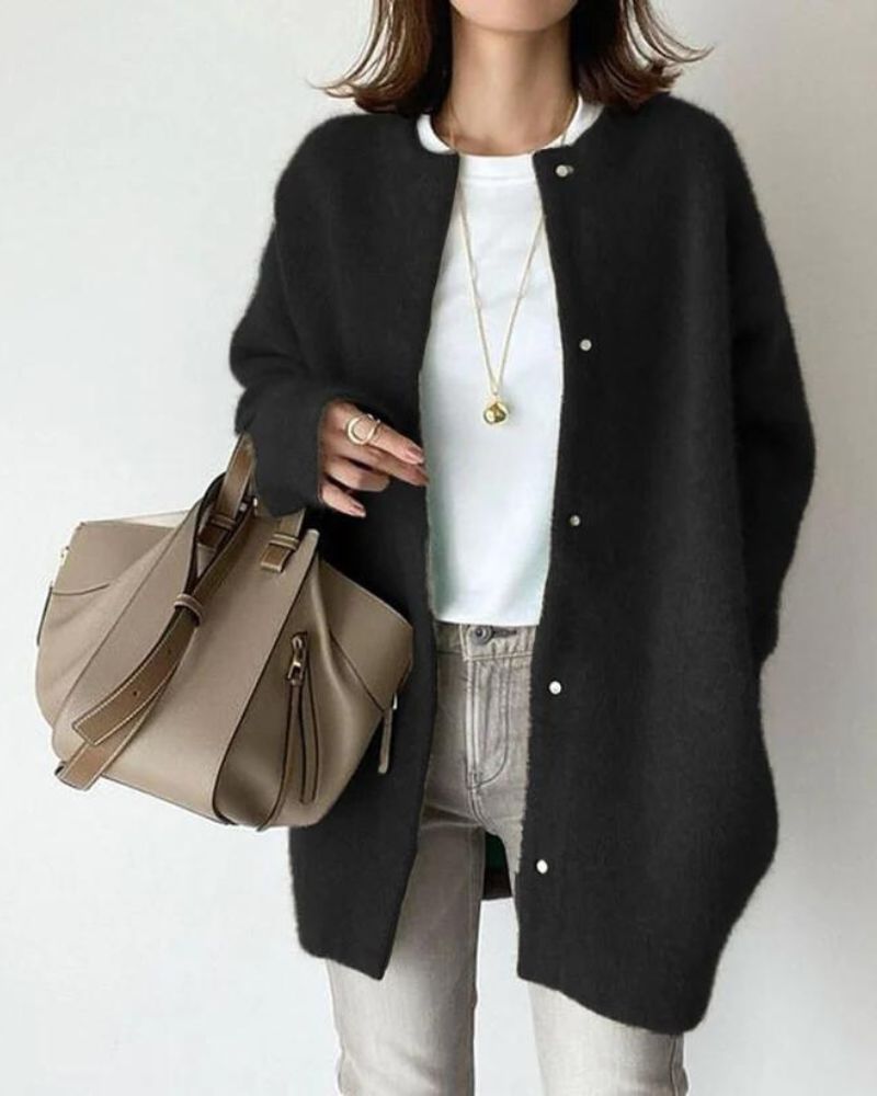 Women's oversized knit cardigan in cozy neutral tones, relaxed mid-length silhouette with button front closure