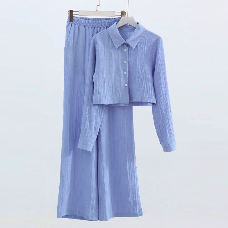 Women's elegant two-piece set in versatile tones with elastic waistband, formal beach office style
