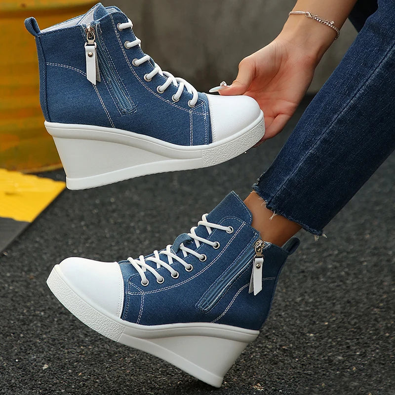 Women's white canvas wedge sneaker with hidden heel lift and breathable side zipper closure